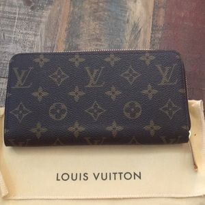 Louis Vuitton Zippy Wallet with red interior.